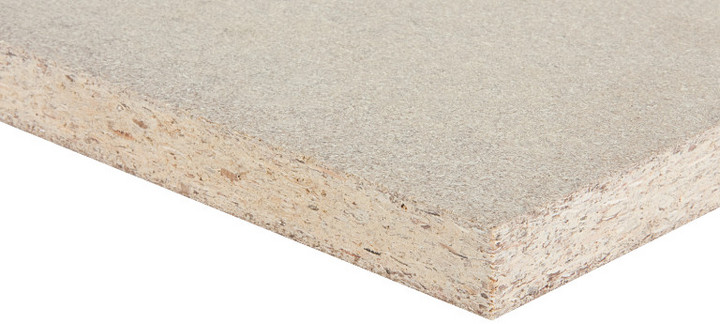 Nahaufnahme einer Spanplatte mit gepressten Holzspänen, vielseitig einsetzbar im Möbelbau und Innenausbau.